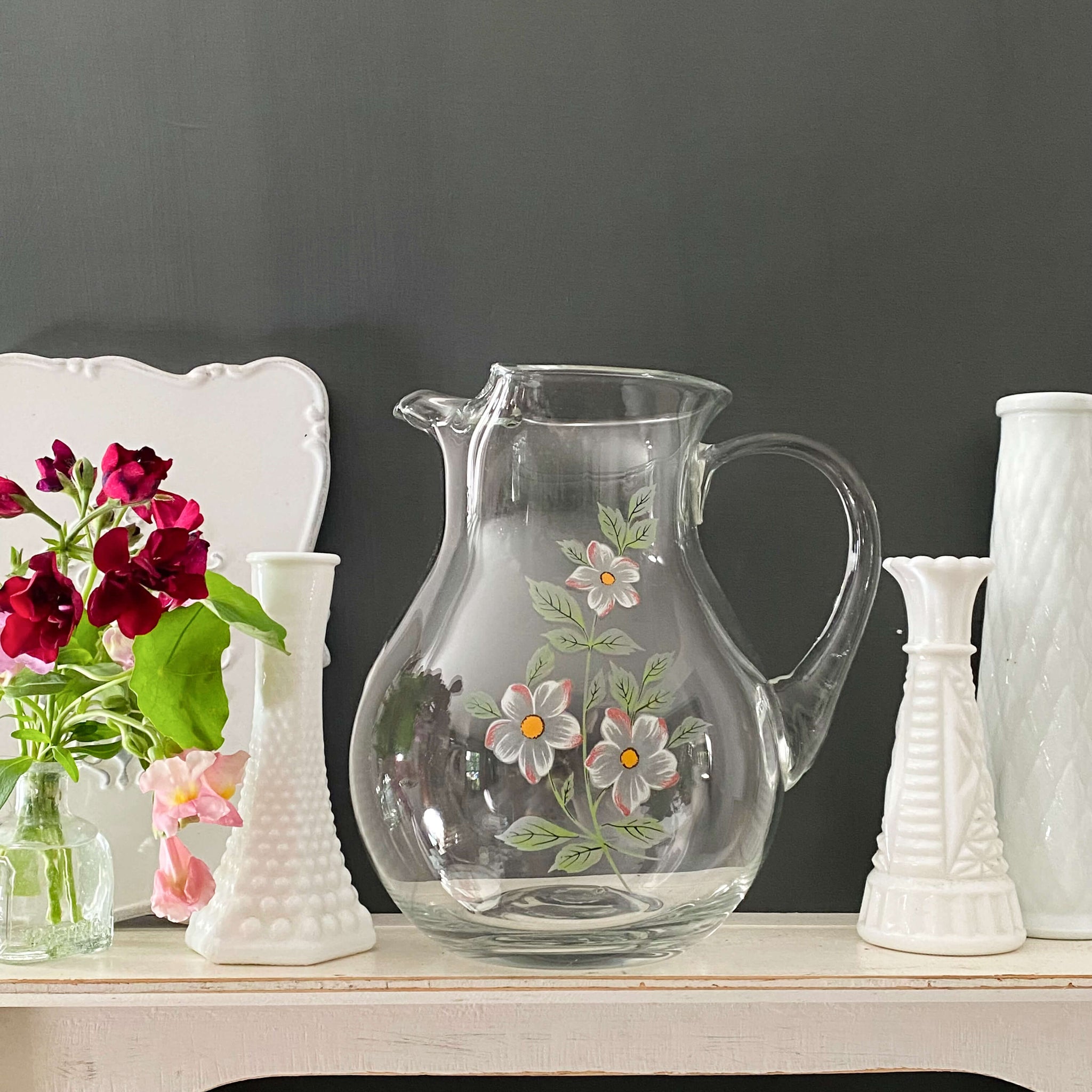 https://shopinthevintagekitchen.com/cdn/shop/files/vintage-handblown-glass-pitcher-made-in-turkey_1_2048x2048.jpg?v=1695478488